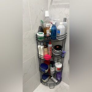 Bathroom organizer with triangular fit for corner placement.